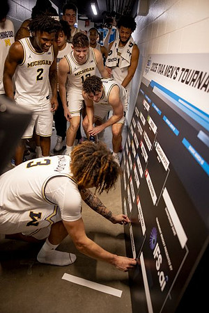 Tre Donaldson (3) and Michigan Team