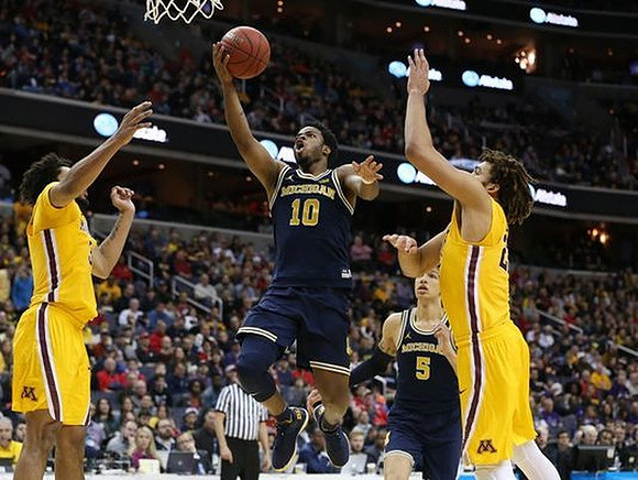 Derrick Walton Jr. (10) and D.J. Wilson (5)