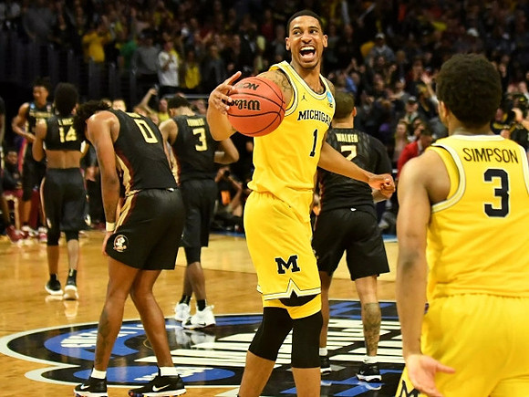 Charles Matthews (1) and Zavier Simpson (3)