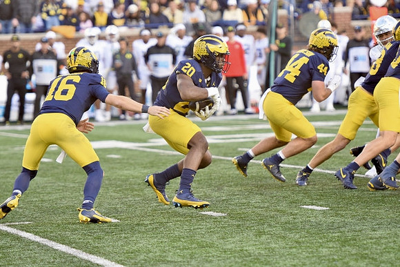 Davis Warren (16), Kalel Mullings (20), and Max Bredeson (44)