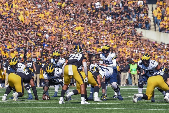Zak Zinter (65), Olusegun Oluwatimi (55), J.J. McCarthy (9), Trevor Keegan (77), Blake Corum (2), and Ryan Hayes (76)