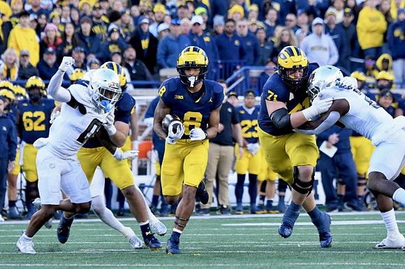 Tyler Morris (8) and Evan Link (71)