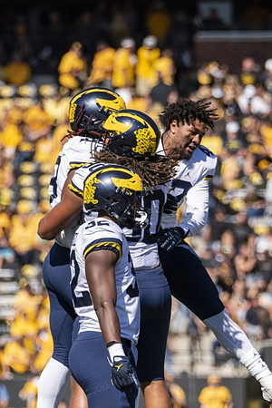 Eyabi Anoma Okie (18), Mike Morris (90), and Jaylen Harrell (32)