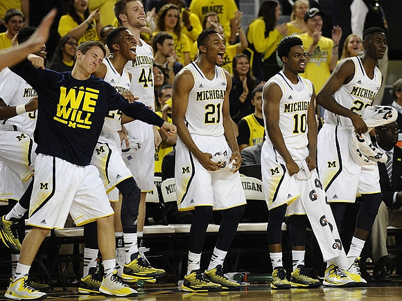 Andrew Dakich (11), Kameron Chatman (3), Aubrey Dawkins (24), Max Bielfeldt (44), Zak Irvin (21), Derrick Walton Jr. (10), and Caris LeVert (23)