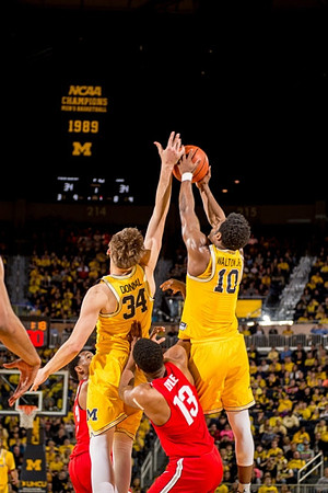 Mark Donnal (34) and Derrick Walton Jr. (10)