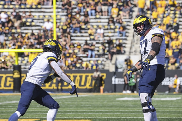 Donovan Edwards (7) and Trevor Keegan (77)