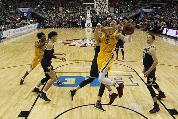 D.J. Wilson (5), Duncan Robinson (22), and Mark Donnal (34)