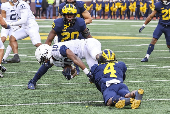 Kalel Mullings (20), Micah Pollard (4), and Matthew Hibner (88)