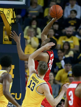 Derrick Walton Jr. (10) and Moritz Wagner (13)