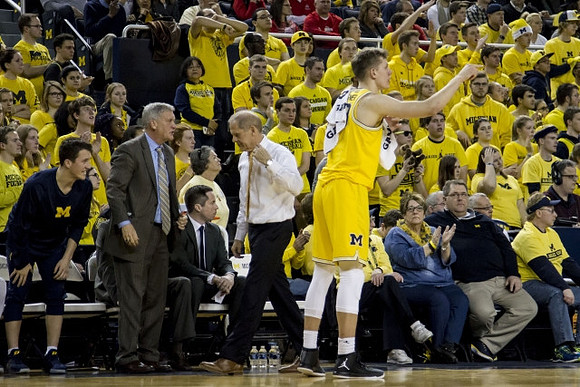 Andrew Dakich (11) , Jeff Meyer, John Beilein, and Moritz Wagner (13)