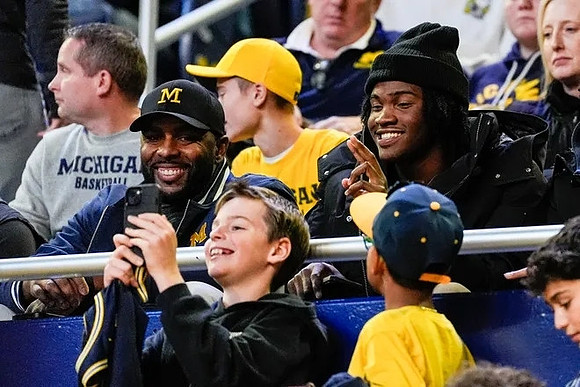 Sherrone Moore and Bryce Underwood