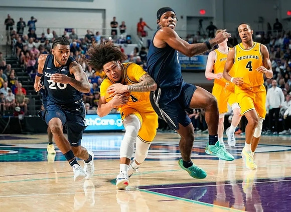 Tre Donaldson (3), Danny Wolf (1), and Nimari Burnett (4)