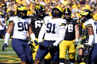 Mike Morris (90), Taylor Upshaw (91), and Junior Colson (25)