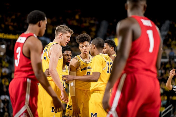Moritz Wagner (13), Derrick Walton Jr. (10), D.J. Wilson (5), Muhammad-Ali Abdur-Rahkman (12), and Zak Irvin (21)