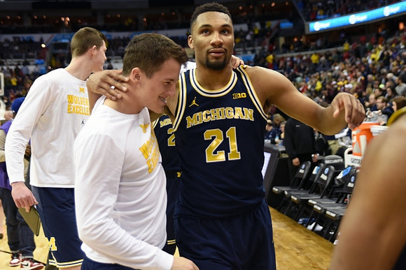 Andrew Dakich (11), Zak Irvin (21), and Jon Teske (15)