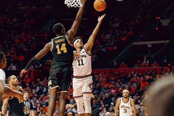 Moussa Diabate (14) and DeVante' Jones (12)