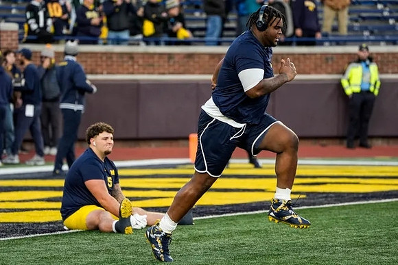 Mason Graham (55) and Kenneth Grant (78)