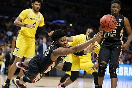 Isaiah Livers (4) and Muhammad-Ali Abdur-Rahkman (12)