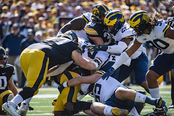 Mason Graham (55), Michael Barrett (23), Junior Colson (25), and Mike Morris (90)