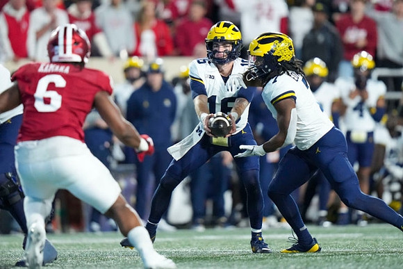 Davis Warren (16) and Donovan Edwards (7)