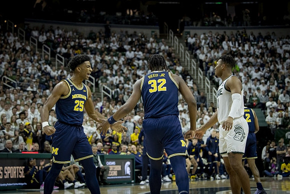 Jace Howard (25), Tarris Reed Jr. (32), and Kobe Bufkin (2)