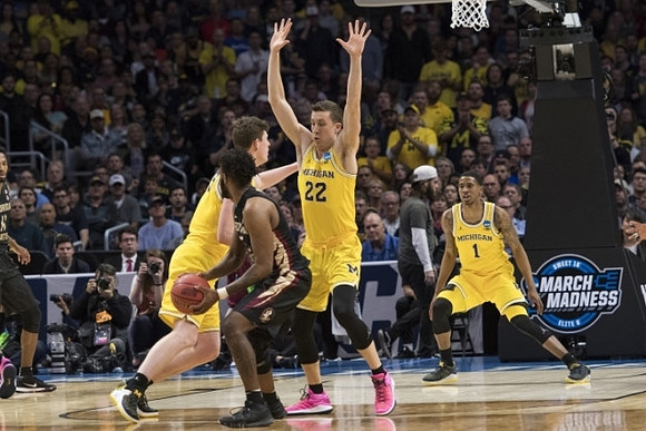 Jon Teske (15), Duncan Robinson (22), and Charles Matthews (1)