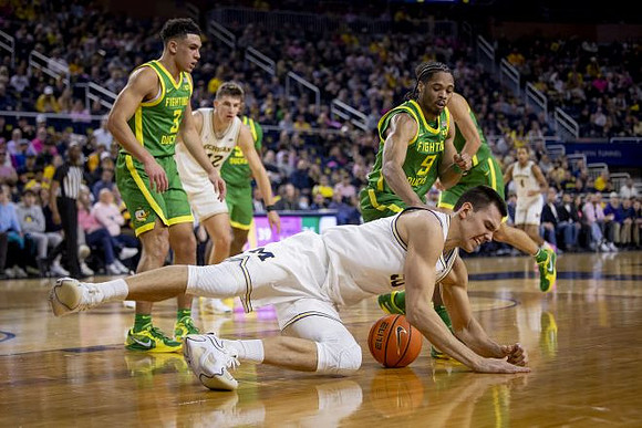 Will Tschetter (42), Vladislav Goldin (50), and Nimari Burnett (4)