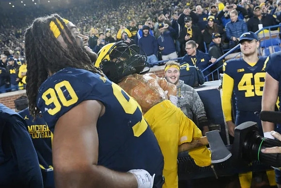 Mike Morris (90) and Paul Bunyan Trophy