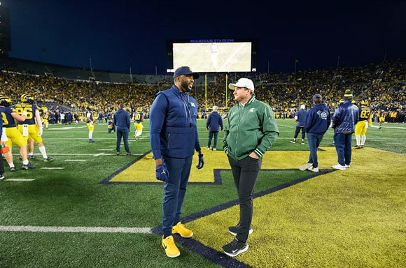 Sherrone Moore and Michigan State Head Coach Jonathan Smith