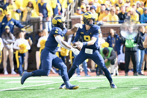 Blake Corum (2) and J.J. McCarthy (9)
