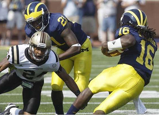 Fitzgerald Toussaint (28) and Denard Robinson (16)