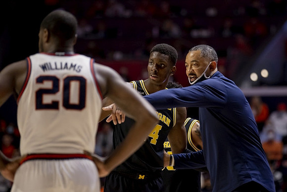 Moussa Diabate (14) and Juwan Howard