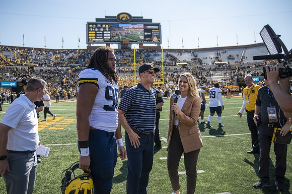 Mike Morris (90) and Jim Harbaugh