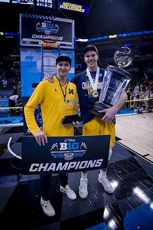 Vladislav Goldin (50) and Big Ten Tournament Championship Trophy