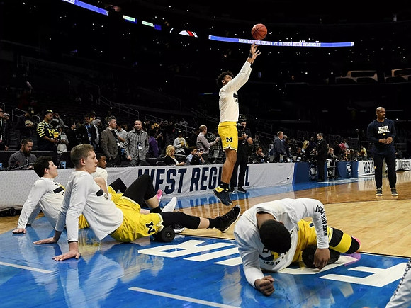 C.J. Baird (24), Moritz Wagner (13), Charles Matthews (1), Isaiah Livers (4), and Zavier Simpson (3)
