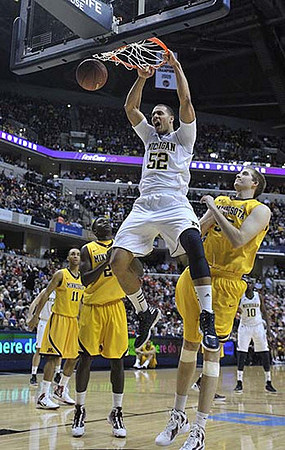 Jordan Morgan (52), Zack Novak (0), and Tim Hardaway Jr. (10)