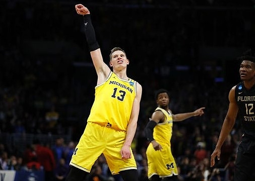 Moritz Wagner (13) and Zavier Simpson (3)