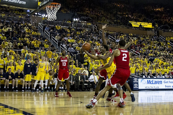 Duncan Robinson (22) and Derrick Walton Jr. (10)
