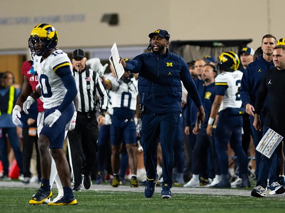 Josaiah Stewart (0) and Sherrone Moore