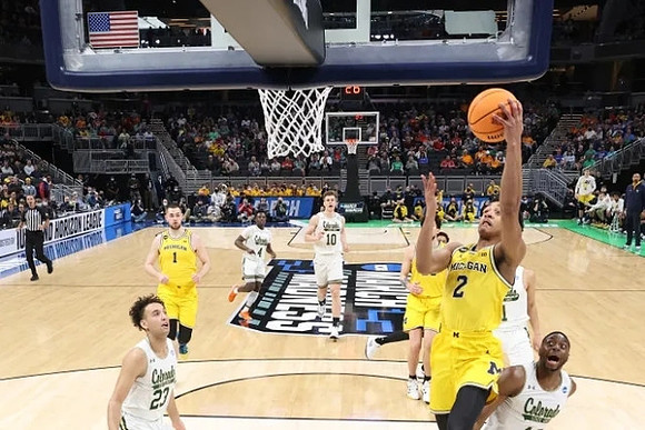 Kobe Bufkin (2), Hunter Dickinson (1), and Eli Brooks (55)