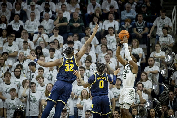 Tarris Reed Jr. (32) and Dug McDaniel (0)