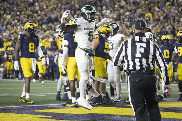 Derrick Moore (8), Mason Graham (55), and Josaiah Stewart (0)