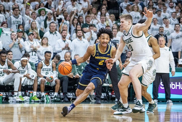 Kobe Bufkin (2) and Michigan State Head Coach Tom Izzo