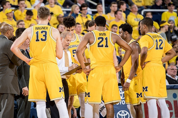 Moritz Wagner (13), John Beilein, D.J. Wilson (5), Zak Irvin (21), Derrick Walton Jr. (10), and Muhammad-Ali Abdur-Rahkman (12)