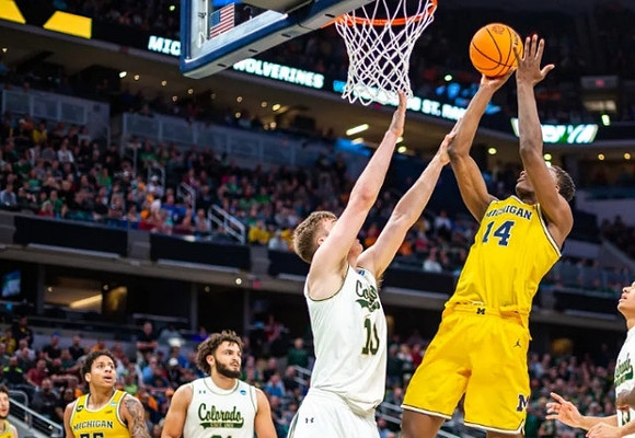 Moussa Diabate (14), Brandon Johns Jr. (23), and Eli Brooks (55)