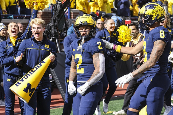 Blake Corum (2) and Ronnie Bell (8)