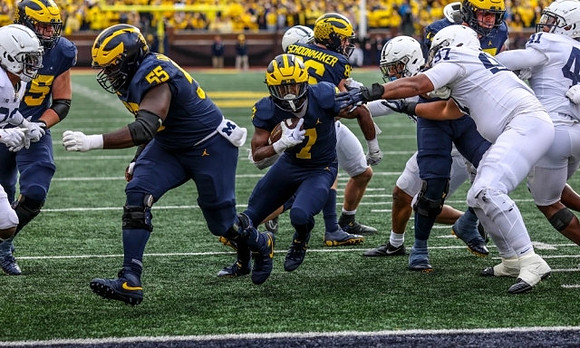 Zak Zinter (65), Olusegun Oluwatimi (55), Donovan Edwards (7), Luke Schoonmaker (86), and Trevor Keegan (77)