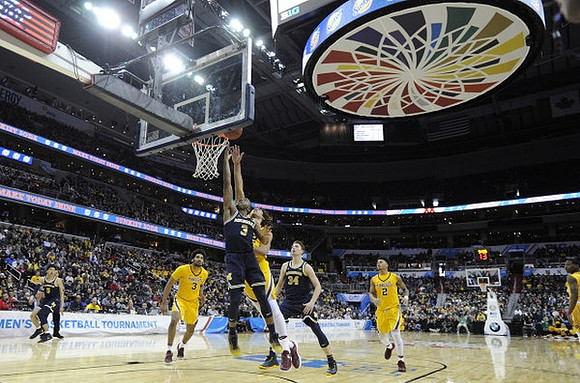 D.J. Wilson (5), Xavier Simpson (3), and Mark Donnal (34)