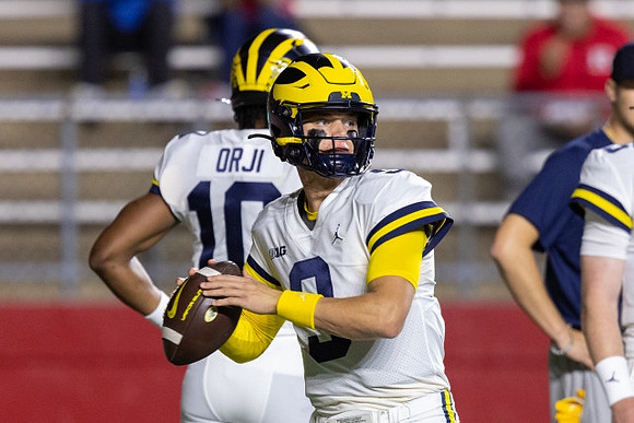 Alex Orji (10) and J.J. McCarthy (9)