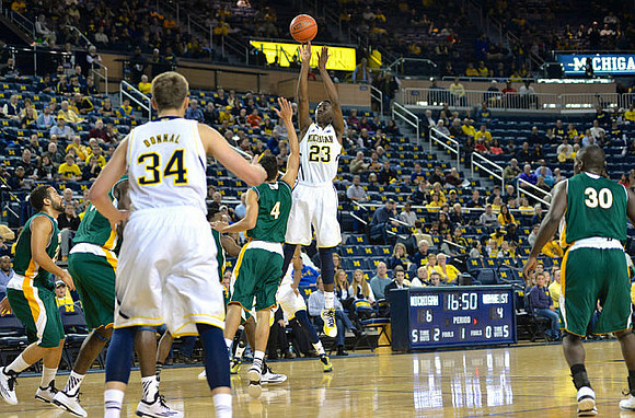 Mark Donnal (34) and Caris LeVert (23)
